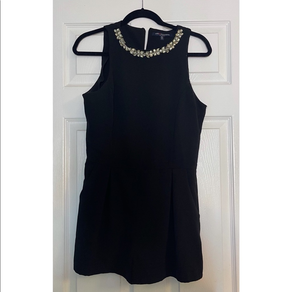One clothing: medium black romper with silver neckline